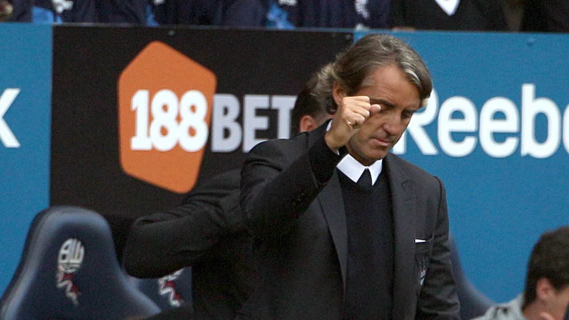 Mancini punches the air after win