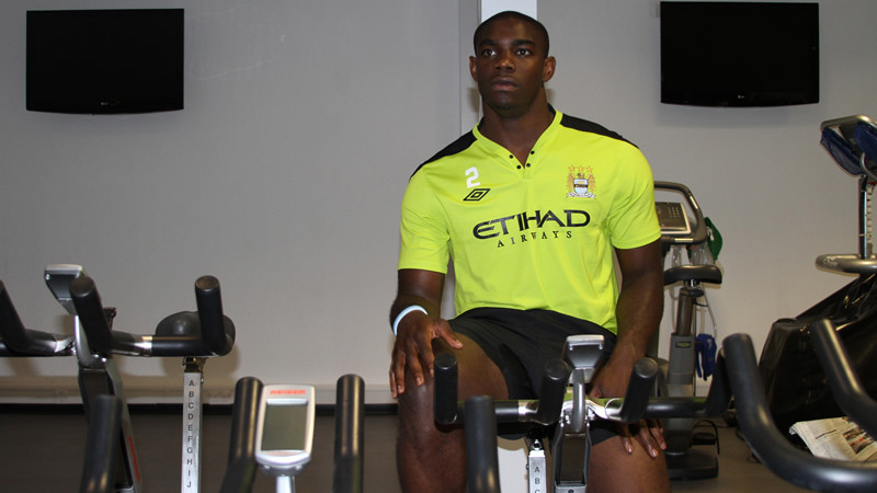 A lone figure in the gym doing his warm down