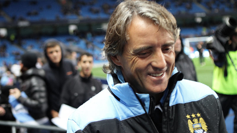 Mancini before the game after siging some fans autographs