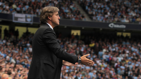 Mancini punches the air after win