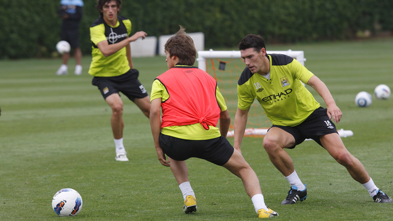 Gareth and Dennis go for the ball