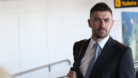Aleksandar Kolarov looks dapper but confused in the departure lounge