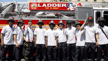 City firemen assemble infront of a New York fire engine for a group shot