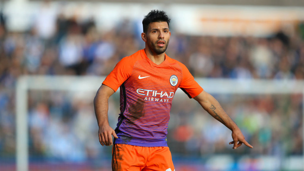 GLORIOUS ORANGE: Aguero tells a teammate exactly where he wants the ball