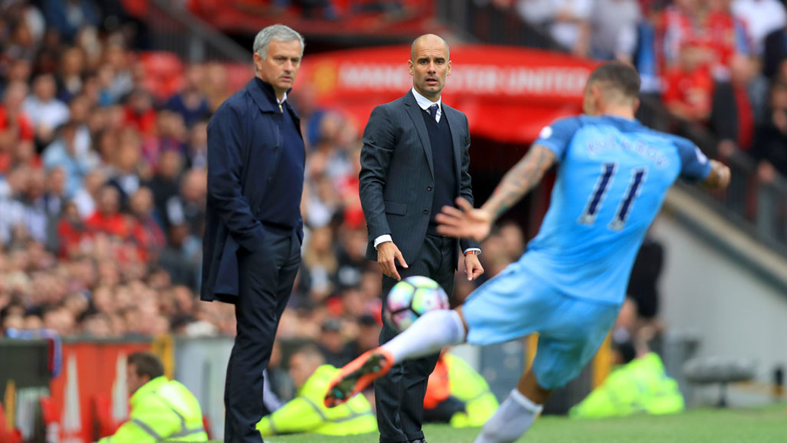 Pep Guardiola watches on