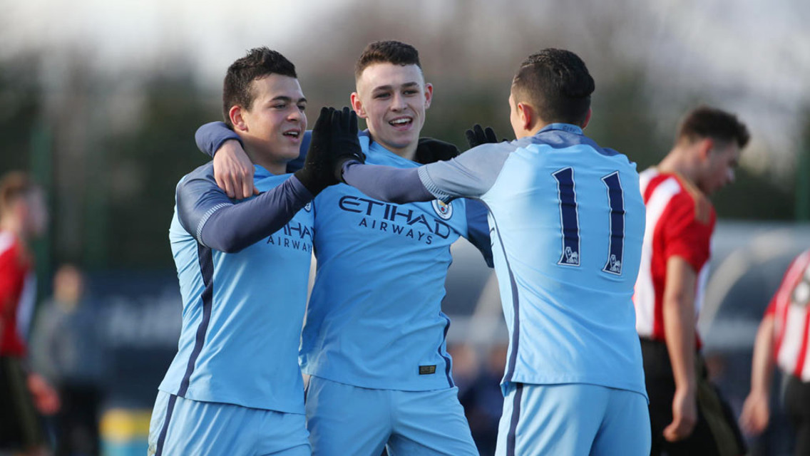 JOY: Lorenzo Gonzalez, Phil Foden and Ian Poveda celebrate the opener