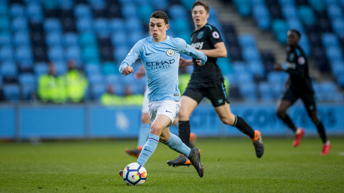 PROBING: Phil Foden looks for a gap.