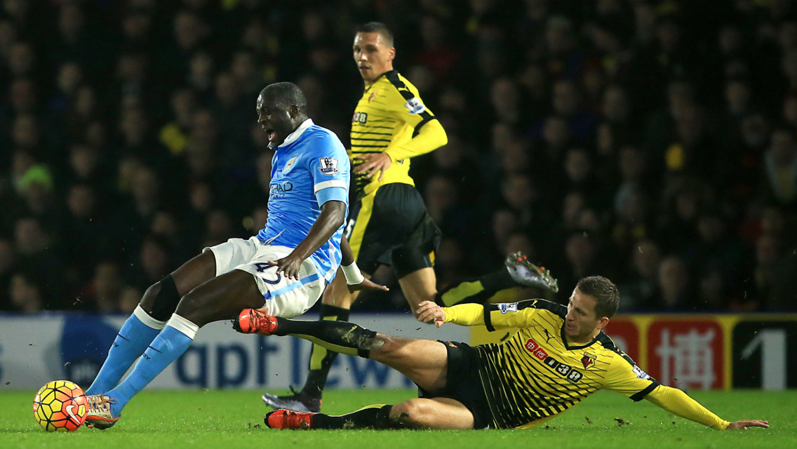 SLIP SLIDING AWAY: Yaya Toure reaches the ball first