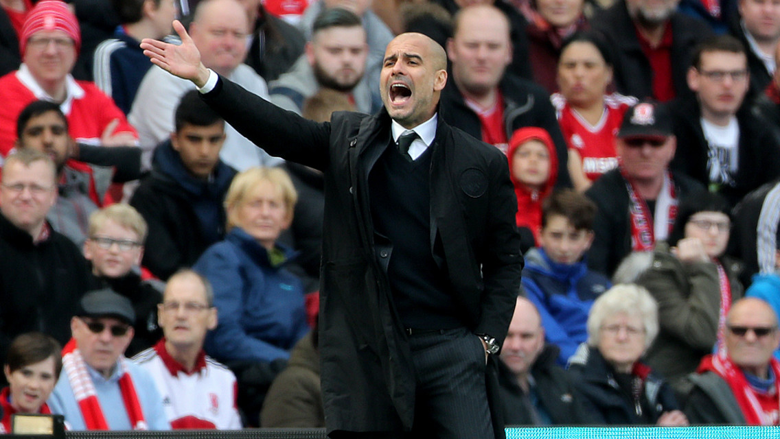 GIVING ORDERS: Pep gestures to his players on the touchline.