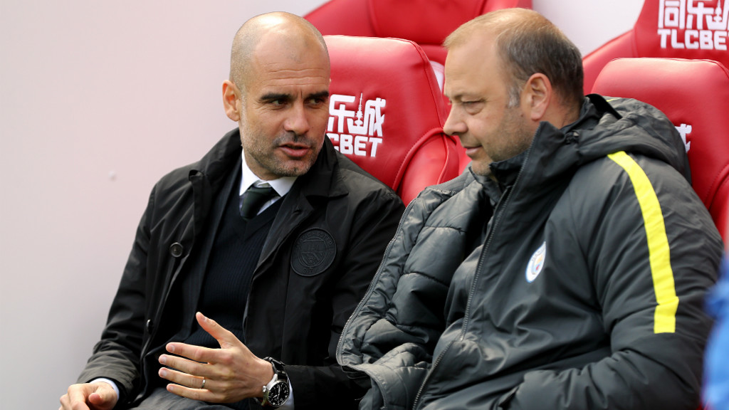 DEEP IN DISCUSSION: Pep consoles with Rodolfo Borrell in the away dugout.