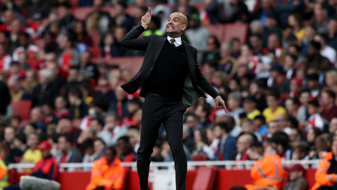 PASSION: Pep Guardiola gestures to his team from the touchline