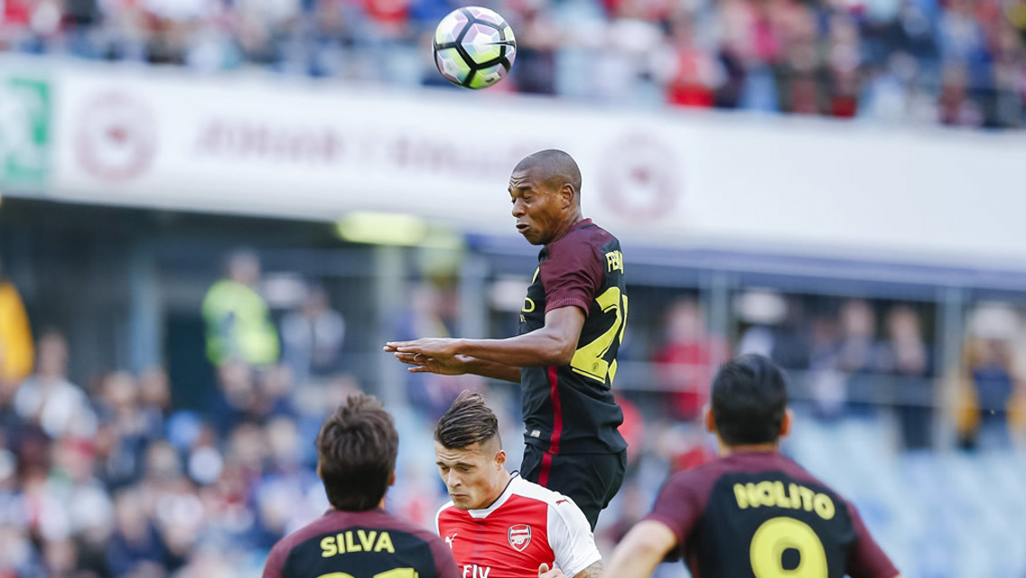RISING HIGH: Fernandinho meets a header