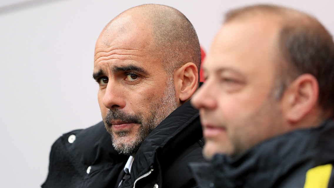 BOSS LOOKS ON : Pep Guardiola watches on at the Riverside.