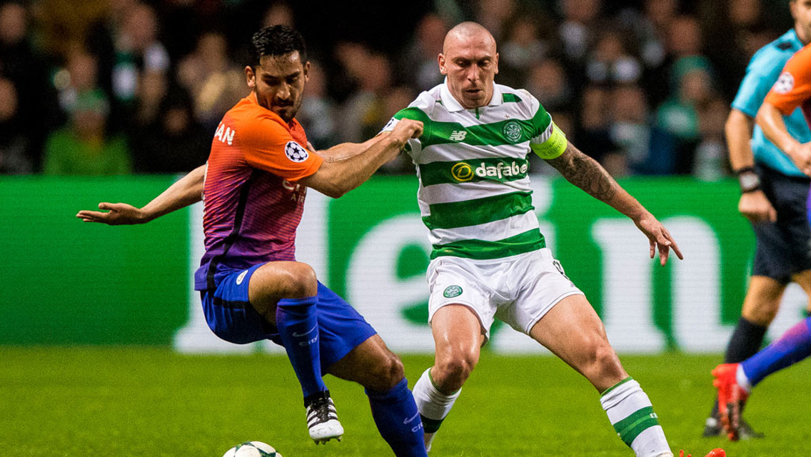 COMPETE: Manchester City's Ilkay Gundogan and Celtic's Scott Brown compete for the ball 