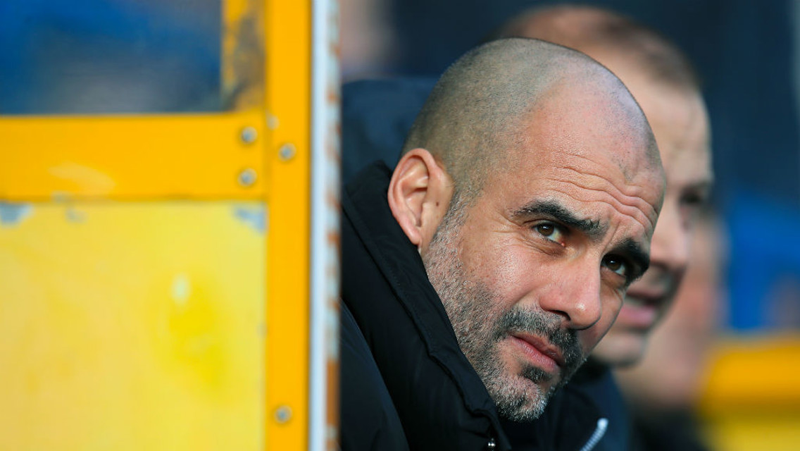 PONDEROUS: Pep takes his seat in the dugout
