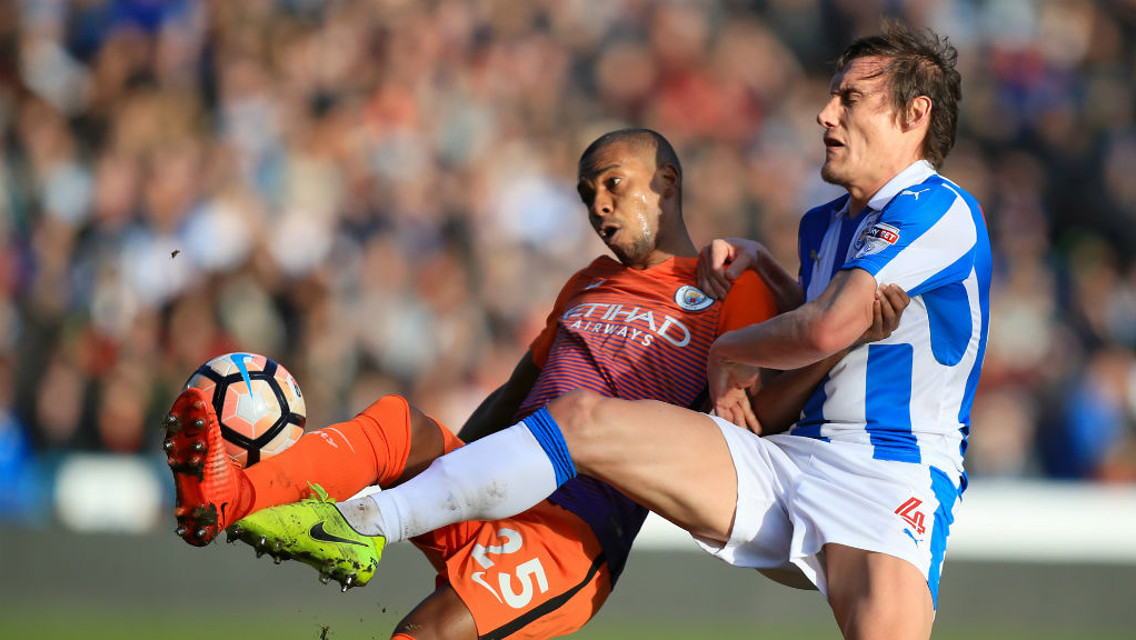 CHALLENGE: Fernandinho and Whitehead battle for the ball