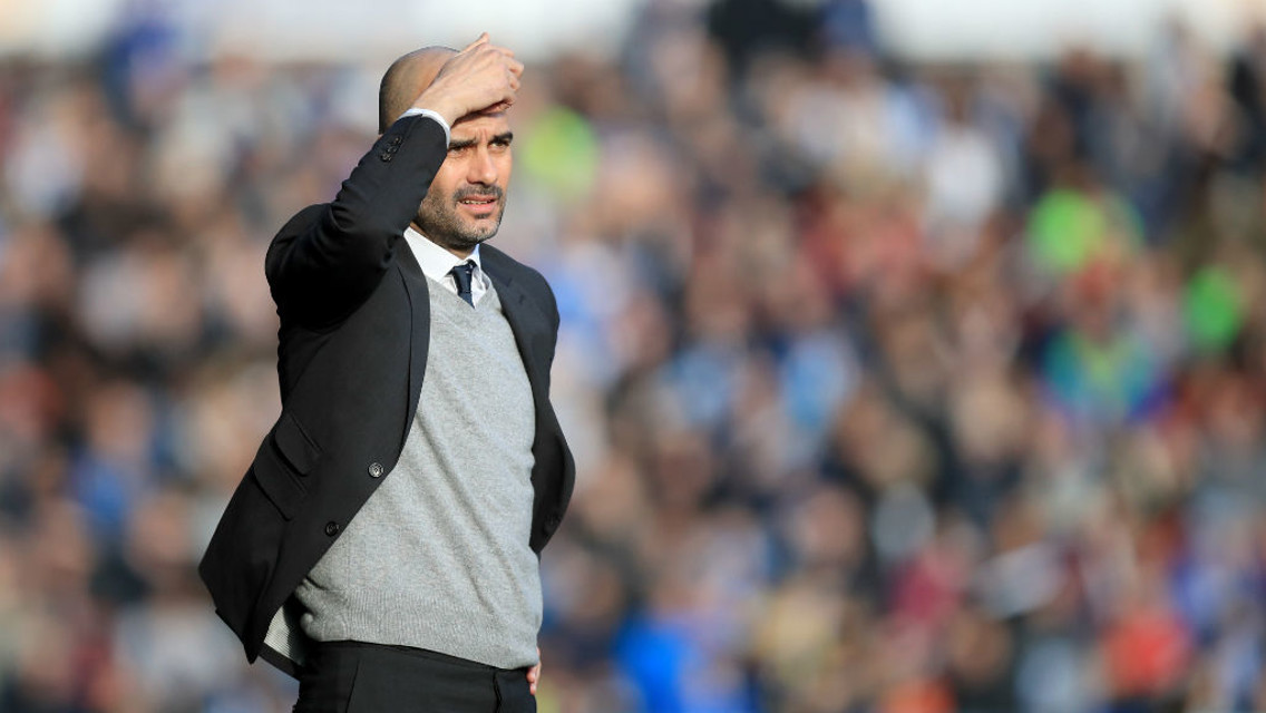 HEAD SCRATCHER: Pep watches on from the touchline
