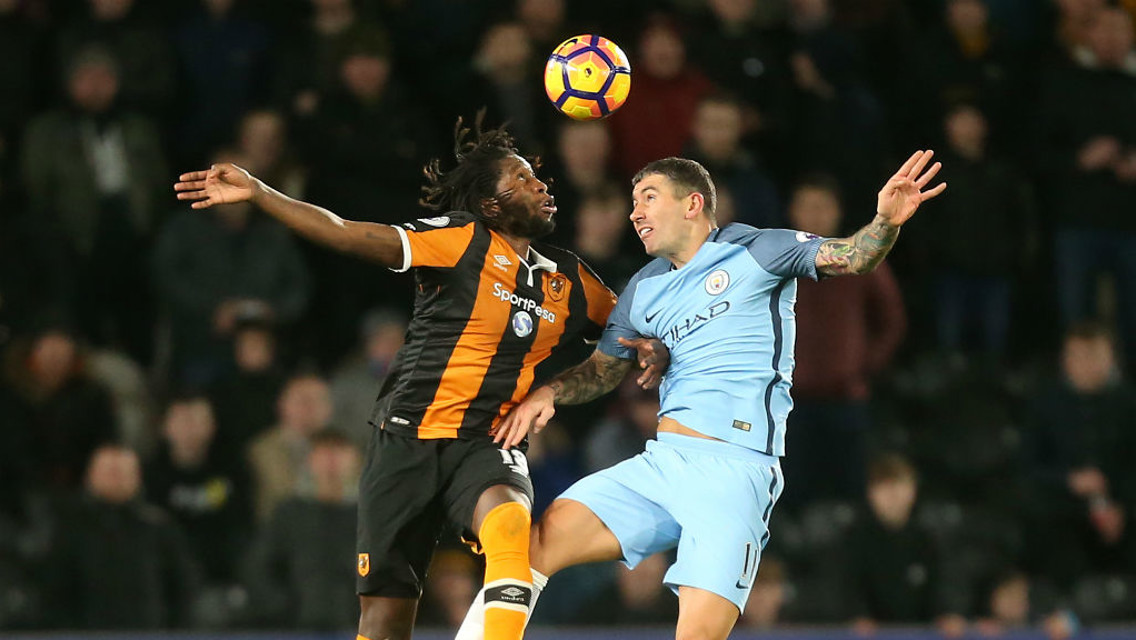 HEADS UP: Aleksandar Kolarov and Dieumerci Mbokani challenge for the ball in the air