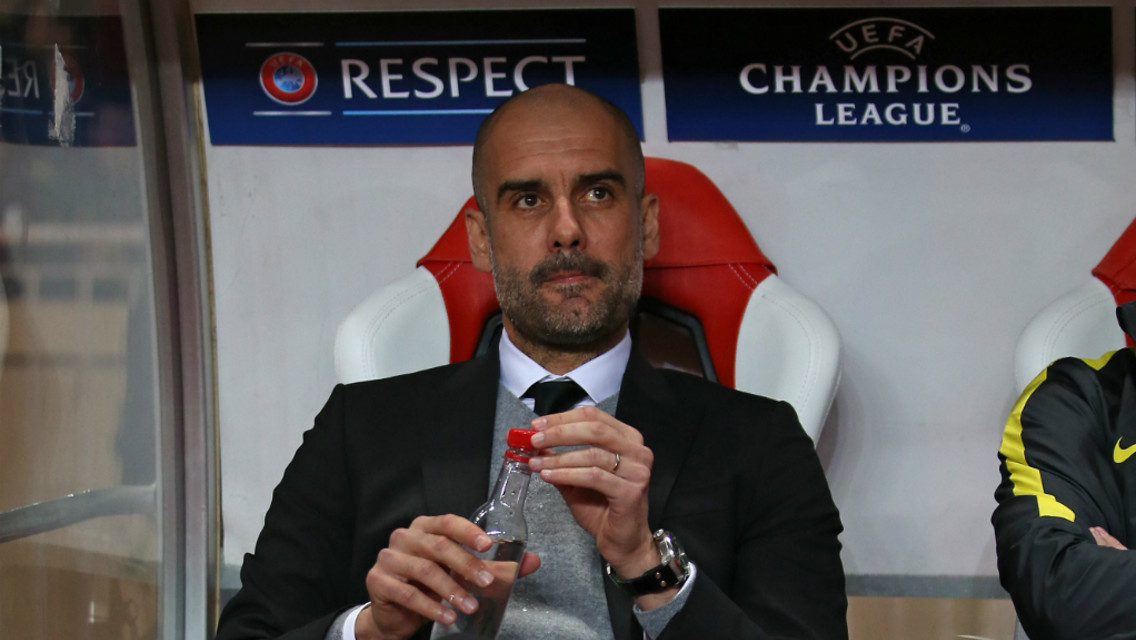WATCHING ON: Pep sat in the dugout in Stade Louis II