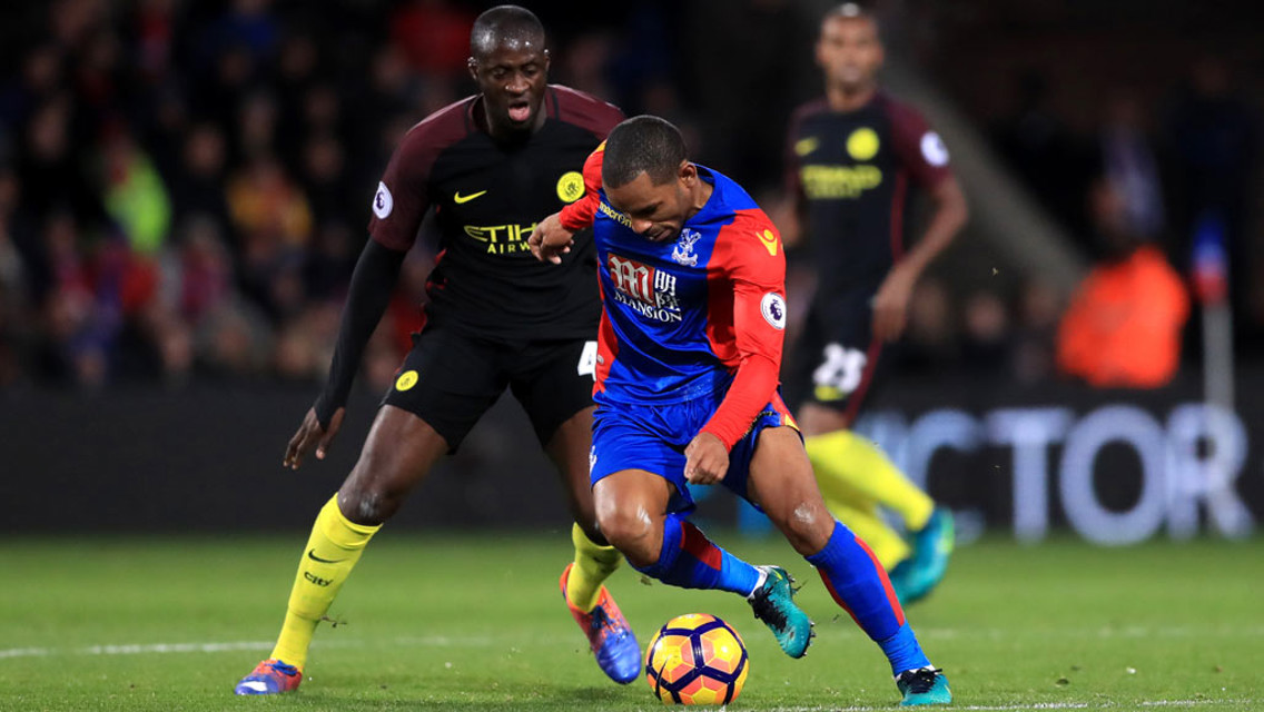 MIDFIELD DUEL - Yaya Toure and Jason Puncheon battle for the ball