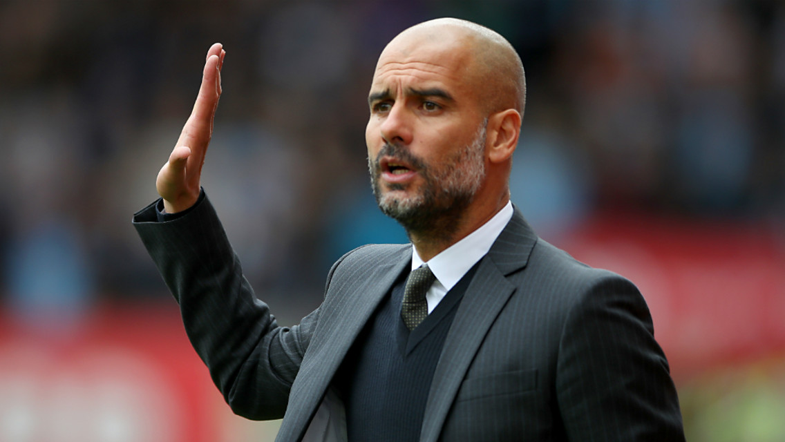FOLLOW MY LEAD: Pep Guardiola delivers instructions from the touchline