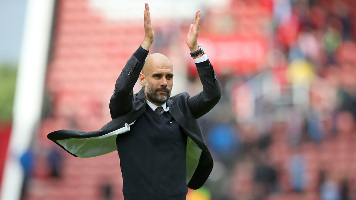 WE'VE GOT GUARDIOLA: The City boss applauds the Blue faithful
