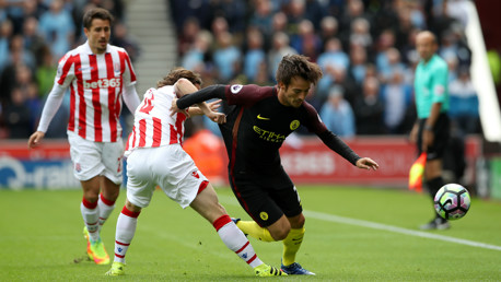 SILVA BULLET: David Silva attempts to escape the attentions of Joe Allen