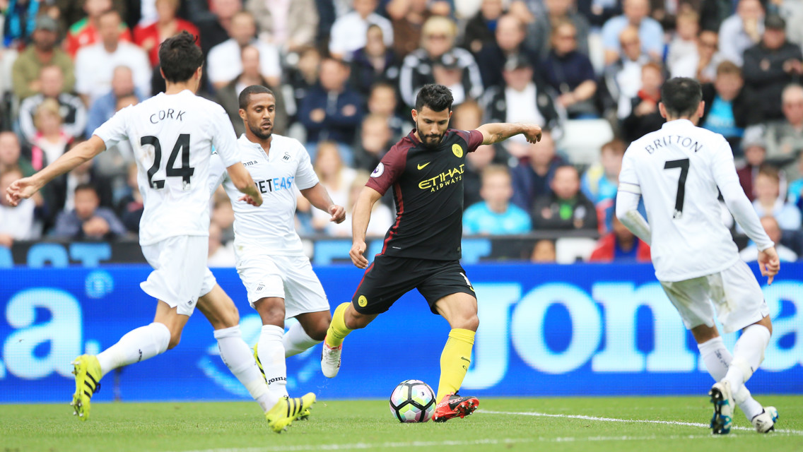 ATTACK: Swansea captain Leon Britton faces up to Sergio Aguero