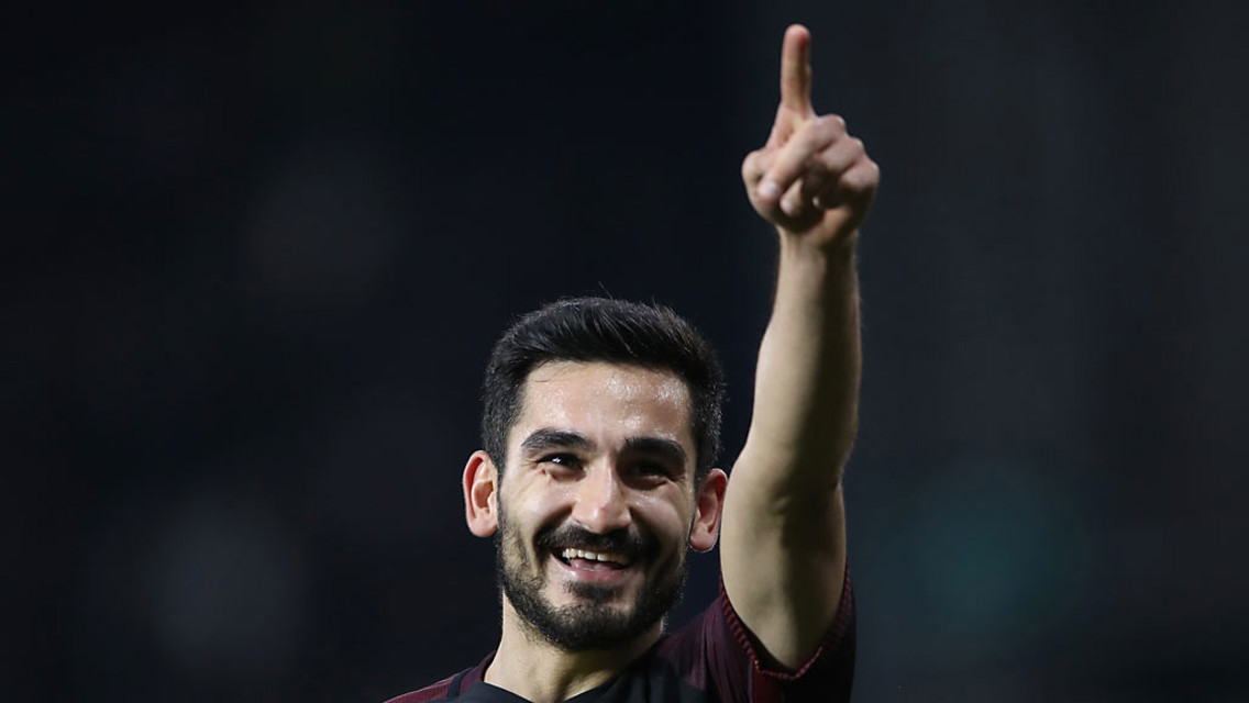 DELIGHT: Ilkay Gundogan points to the City fans after netting the third