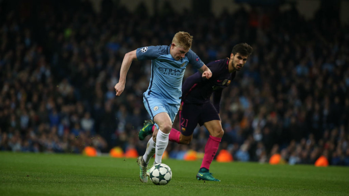 BREAK AWAY: De Bruyne moves past Andre Gomes in the midfield