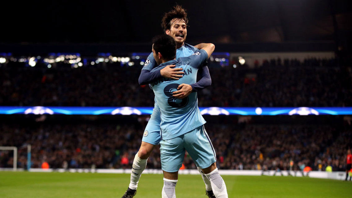 JUMP FOR JOY: Silva and Gundogan embrace after the German's strike