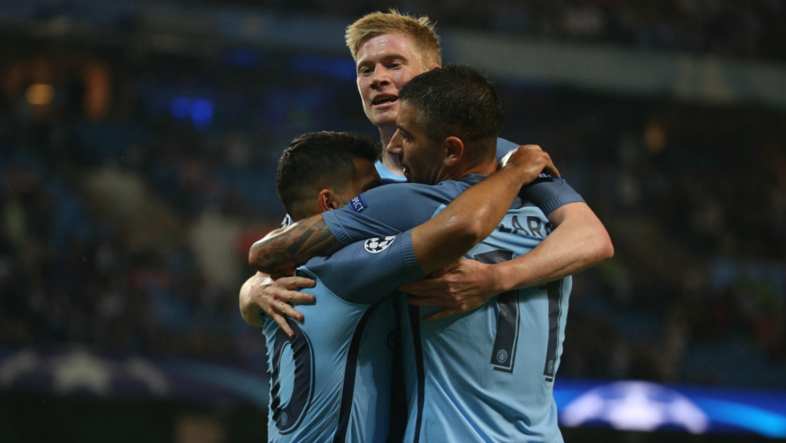 MOBBED: Aleks Kolarov and Kevin De Bruyne congratulate Aguero on his opener