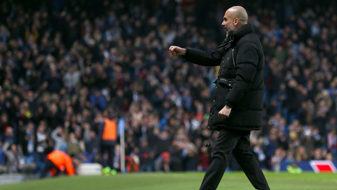 FIST PUMP: Pep celebrates City's third goal of the evening.