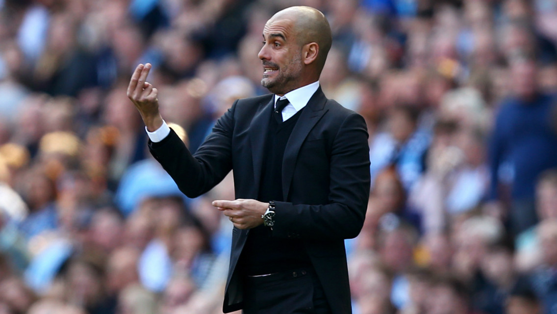 ORGANISING THE TROOPS: Pep directs his players from the sideline.