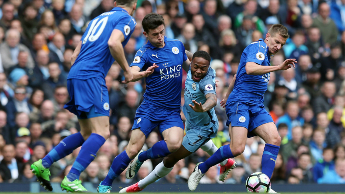 STERLING SANDWICH: Raheem is trapped between two Leicester players as Andy King looks on.