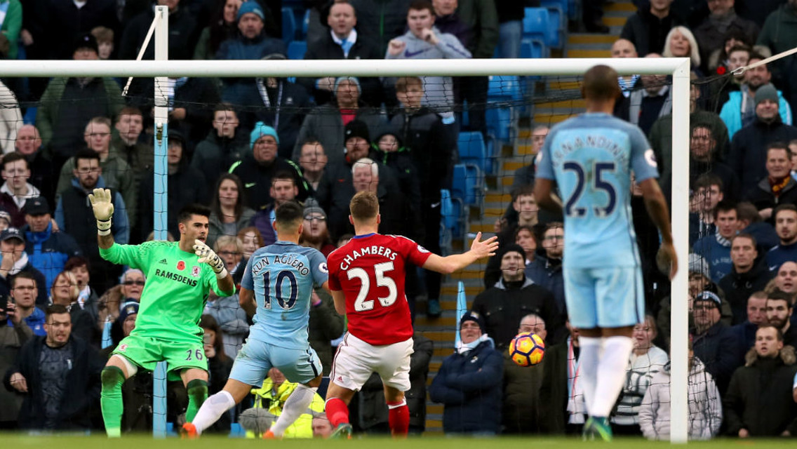 TUCKS IT HOME: Aguero scores his 150th goal for City just before the half-time whistle