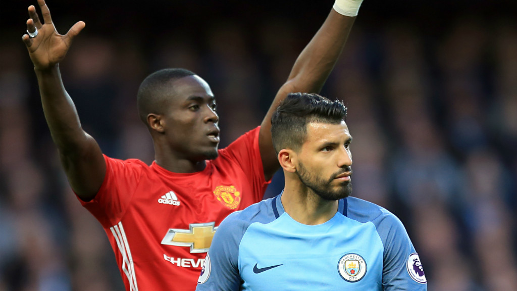 TIGHT MARKING: Eric Bailly pays close attention to Sergio Aguero in the first half.