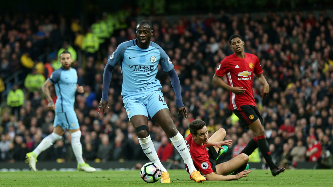 SEE YOU LATER: Yaya leaves Herrera in his wake as he powers forward.