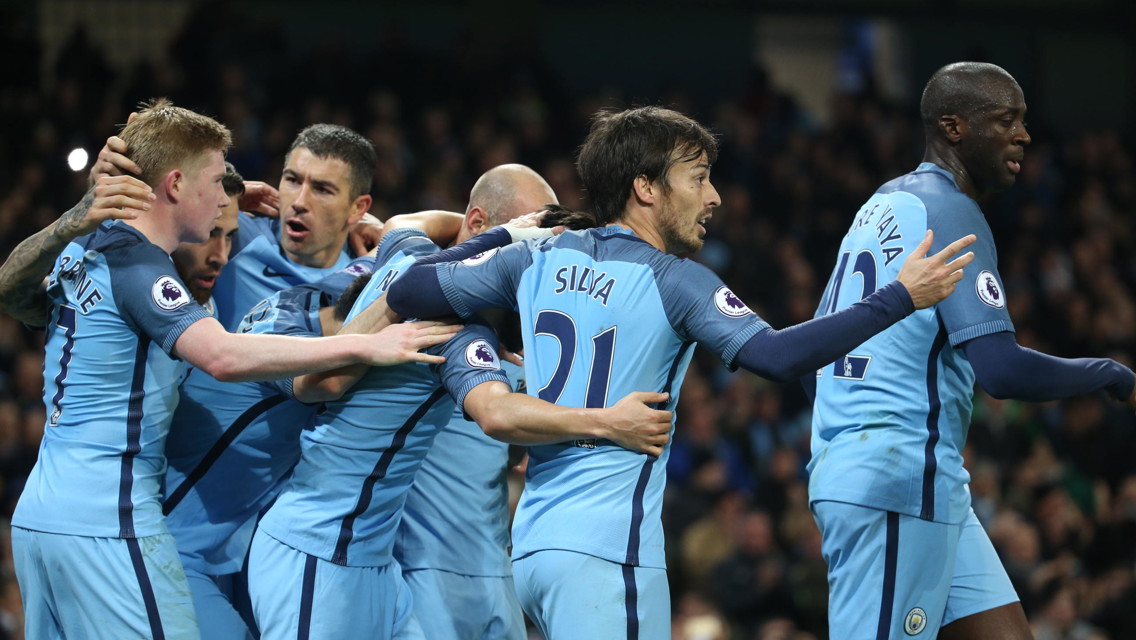 TOGETHER: The team rush to congratulate Pablo Zabaleta