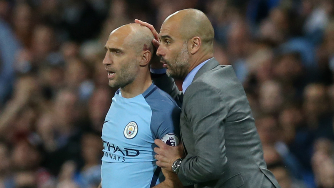 LEGEND: Pep Guardiola gives Pablo Zabaleta some encouraging words as he's about to come on