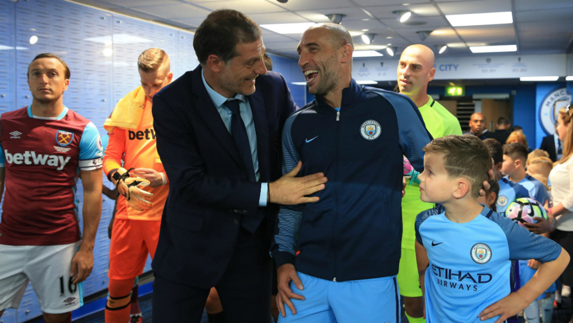 REUNITED: Slaven Bilic and Pablo Zabaleta catch up in the tunnel