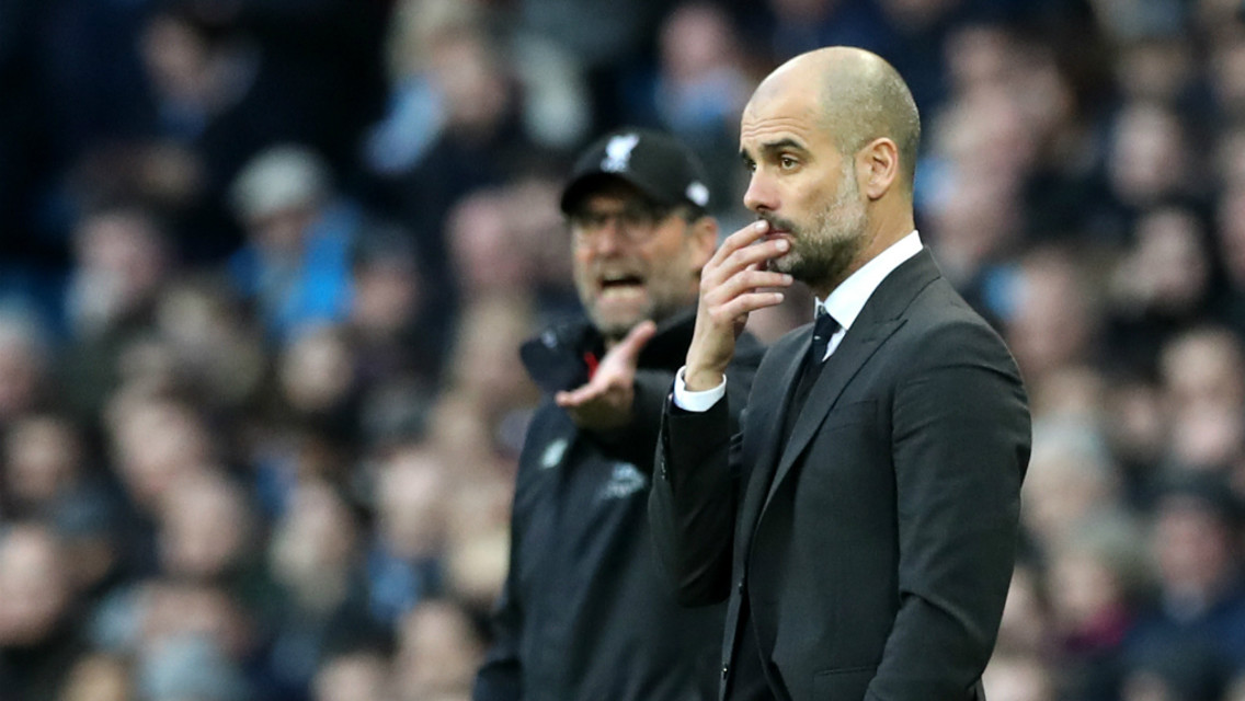 WATCHING ON: Pep and Klopp assess the action from the touchline.