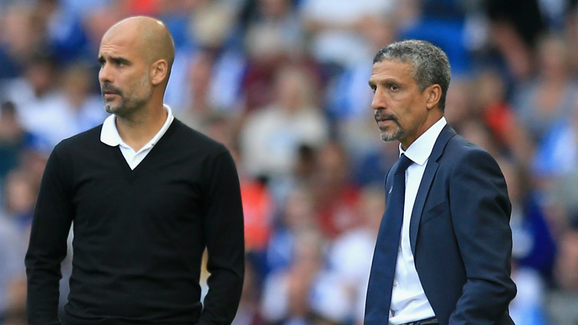 THE BOSS: Pep watches on alongside Brighton manager Chris Hughton.