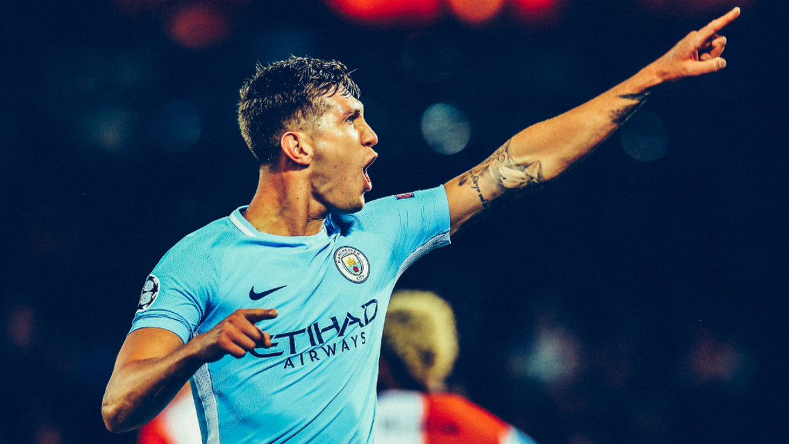 BLUE ARMY: John Stones points to the travelling City faithful