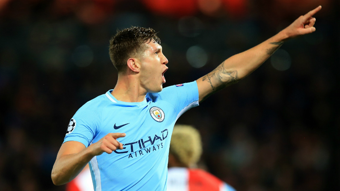 BLUE ARMY: John Stones points to the travelling City fans