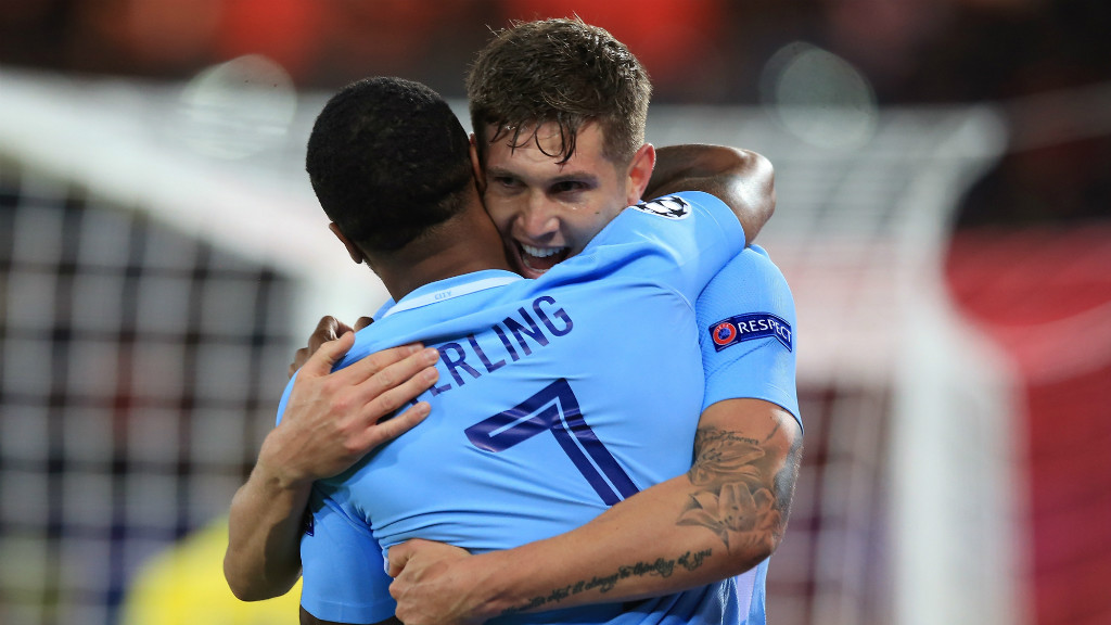 LION HEARTS: Raheem Sterling congratulates John Stones