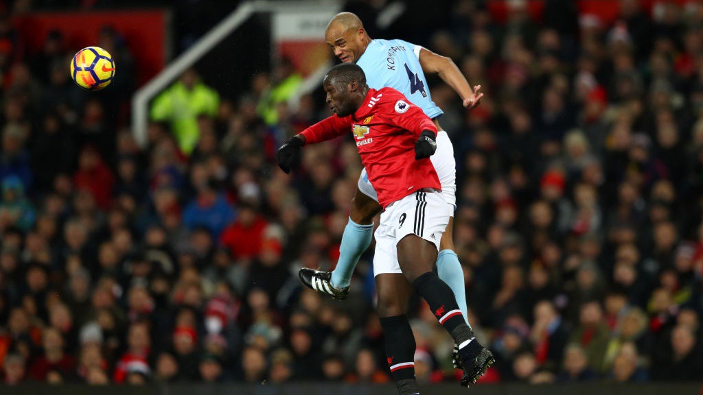KEY BATTLE: Vincent Kompany gets the better of Romelu Lukaku in a first-half aerial duel. 