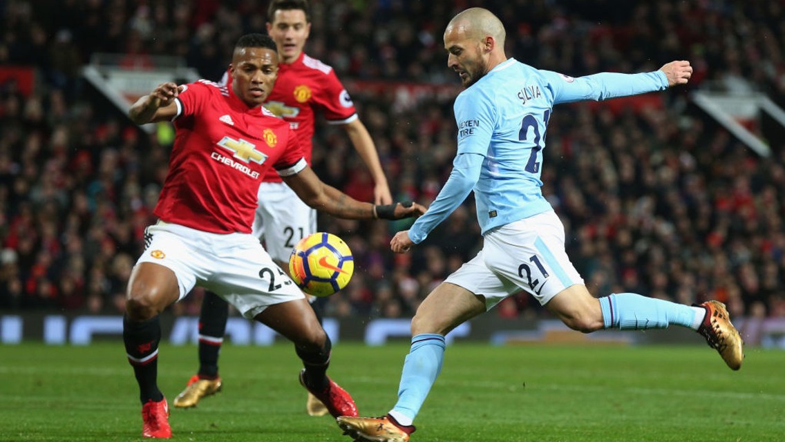 ON THE VOLLEY: David Silva takes aim in the first half at Old Trafford. 