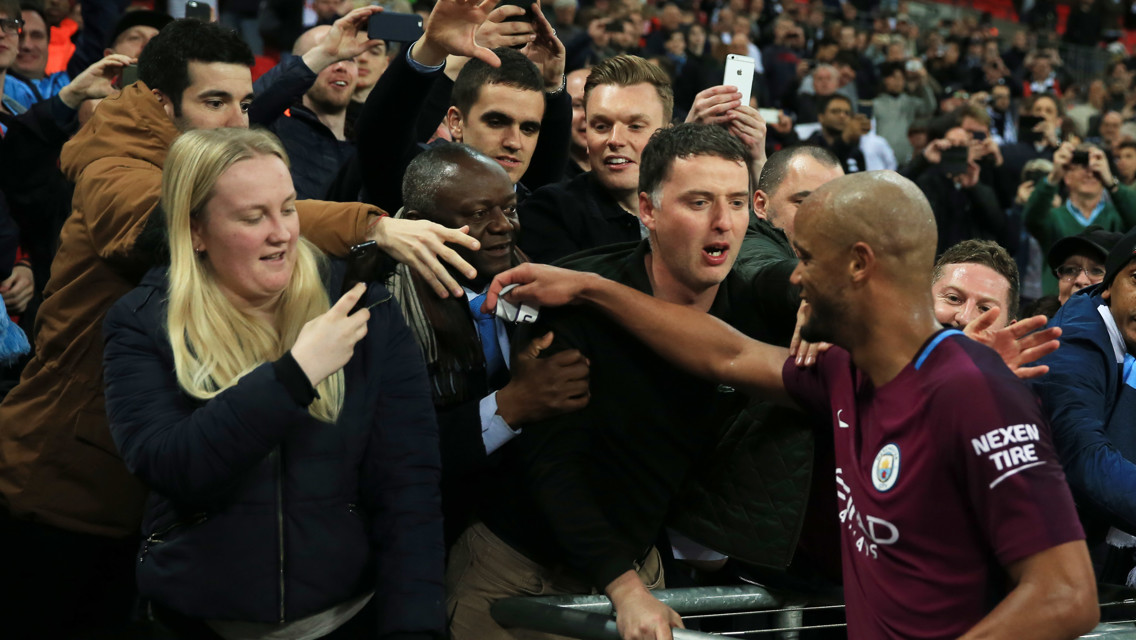 KAPTAIN: Vincent Kompany celebrates with the travelling City fans
