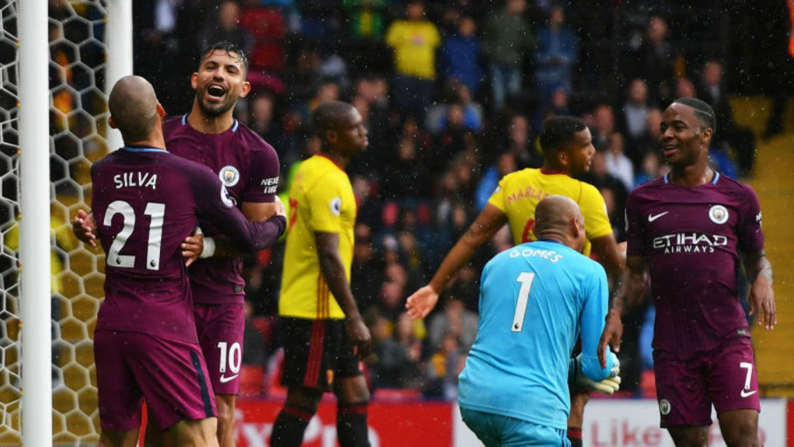 RAIN MAN: Sergio Aguero is singing in the rain after his second goal